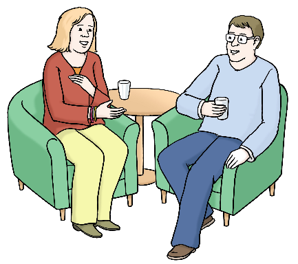 Eine Frau und ein Mann sitzen in Sesseln. Sie trinken Kaffee und reden miteinander.